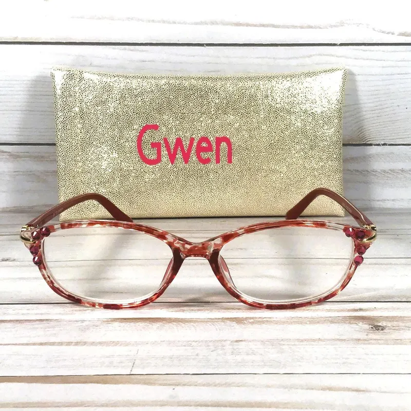 Red Swarovski Crystals highlight the frame of this reader. Faux Glitter Case with a Name. +1.25